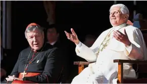  ?? — AFP ?? Better times: A file photo showing Pope Benedict waving to World Youth Day volunteers as Pell looks on at The Domain in Sydney.