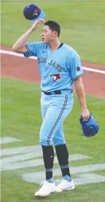  ?? TIMOTHY T. LUDWIG/USA TODAY SPORTS ?? Blue Jays starting pitcher Nate Pearson comes out of the game during a pitching change in the third inning against the Miami Marlins Wednesday at Sahlen Field.