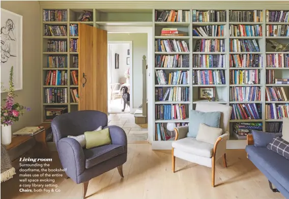  ??  ?? Living room Surroundin­g the doorframe, the bookshelf makes use of the entire wall space evoking a cosy library setting.
Chairs, both Foy & Co