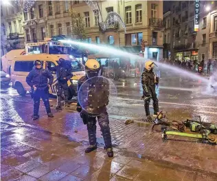  ?? Photo: London Evening Standard ?? Police takes control after the riot by Belgian fans in Brussels following their 2-0 loss to Morocco on November 27, 2022.