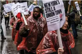  ?? ?? Members of the Daily News union and supporters picket during a one-day walkout in New York on 25 January. Photograph: Alex Kent/Bloomberg via Getty Images
