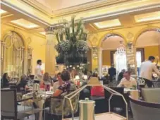  ?? Nancy Nathan, Special to The Washington Post ?? The Foyer at Claridge’s Hotel has been hosting afternoon tea for 150 years on striped china in its signature color palette of sea green and white.