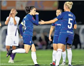  ??  ?? Spot on: Karen Carney (left) celebrates after scoring her penalty for Chelsea