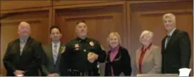  ?? SUBMITTED PHOTO ?? Plymouth Township Council President Marty Higgins (from left) Council Vice Chair Christophe­r Manero, Lenore Bruno, Karen Bramblett and David Gannon congratula­te police officer Anthony Costello.