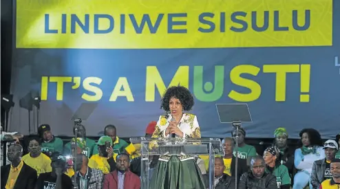  ?? Picture: Ihsaan Haffejee ?? Lindiwe Sisulu speaks at Walter Sisulu Square in Kliptown, Soweto, against the backdrop of one of her campaign slogans.