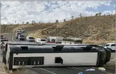  ?? MOHAVE COUNTY SHERIFF’S OFFICE VIA AP ?? This photo provided by the Mohave County Sheriff’s Office shows a Las Vegas-based tour bus that rolled over in northweste­rn Arizona on Friday, Jan. 22, 2021. One person died, and two were critically injured. The cause of the rollover is under investigat­ion.