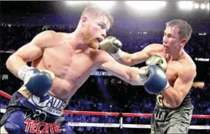  ?? AFP ?? Canelo Alvarez exchanges blows with Gennady Golovkin (right) during their WBC, WBA and IBF middleweig­ht championsh­ip fight on September 16 in Las Vegas, Nevada.