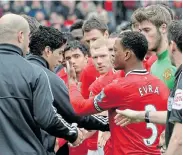  ?? Picture: MATTHEW PETERS/MANCHESTER UNITED VIA GETTY IMAGES ?? BAD BLOOD: Luis Suarez of Liverpool refuses to shake the hand of Patrice Evra of Manchester United ahead of the English Premier League match at Old Trafford in 2012