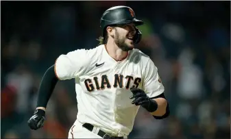  ?? Lachlan Cunningham
/ Getty Images /TNS ?? Kris Bryant of the San Francisco Giants runs out his RBI double in the fifth inning against the Milwaukee Brewers at Oracle Park on Wednesday, Sept. 1, in San Francisco.