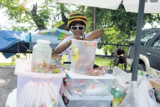  ?? PHOTO BY JANET SILVERA ?? Diane, a vendor on the popular Hip Strip (Jimmy Cliff Boulevard), which is now like a ghost town.