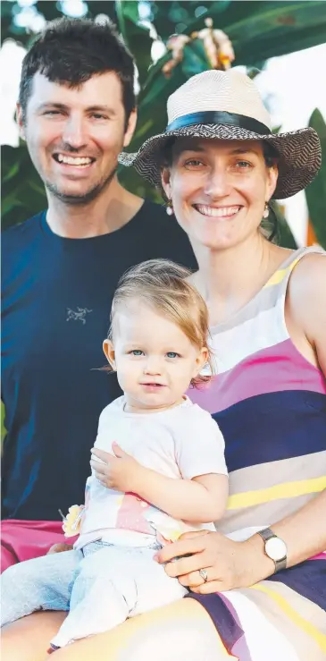  ?? Picture: BRENDAN RADKE ?? FAMILY TIME: Aaron Goldstein and Kate Brennan with their daughter Grace, 16 months, on the Cairns Esplanade.