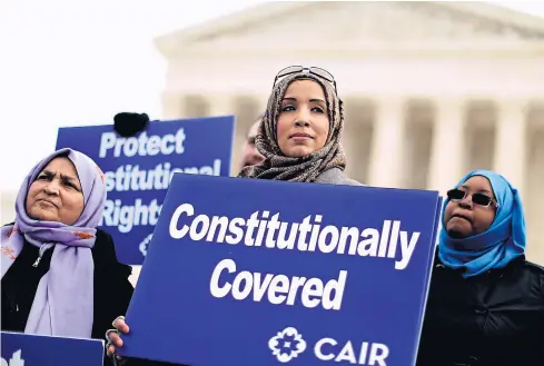  ?? AFP ?? Zainab Chaudry, centre, joins other supporters from the Council on American-Islamic Relations outside the US Supreme Court on Feb 25, 2015 in Washington, DC, after Samantha Elauf, of Tulsa, Oklahoma, brought religious discrimina­tion charges against...