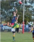  ?? PHOTO: KEVIN FARMER ?? AERIAL ATTEMPT: University’s Jackson Paynter leaps for the ball against Goondiwind­i.