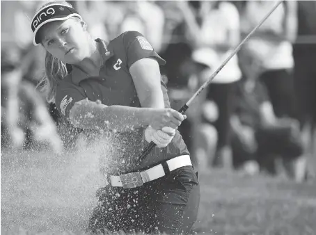  ?? PHOTOS: JONATHAN HAYWARD/THE CANADIAN PRESS ?? Brooke Henderson is tied for second heading into Saturday at the CP Women’s Open in Regina.