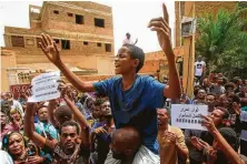  ?? Ashraf Shazly / AFP / Getty Images ?? A Sudanese protester chants Sunday during a demonstrat­ion against Sudan’s ruling generals in Khartoum as a rebuke for the violent June 3 crackdown that left more than 120 dead.