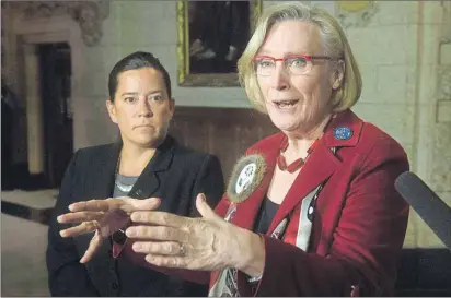  ?? CP PHOTO ?? Minister of Justice and Attorney General of Canada Jody Wilson-Raybould, left, looks on as Minister of Indigenous and Northern Affairs Carolyn Bennett speaks about the Canadian Human Rights Tribunal regarding discrimina­tion against First Nations...