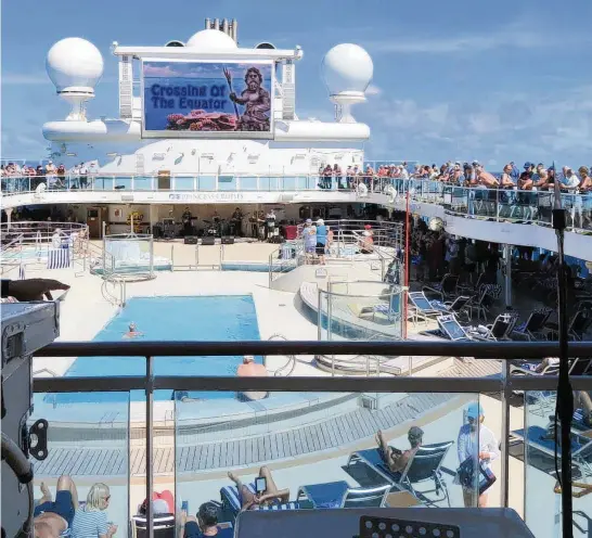  ?? DOUG WHITLOCK ?? A crowd gathered on the Coral Princess on March 28 as the ship crossed the equator. The ship is near Puerto Rico, where it received a resupply from sister ship Regal Princess. There are 1,898 people, including 1,020 passengers and 878 crew, on the Coral Princess.