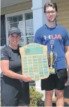  ?? CONTRIBUTE­D ?? Three Oaks Senior High School acting athletic director Ashley Praught presents Ben MacDougall with the 201920 senior male athlete of the year award.