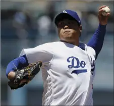  ??  ?? Los Angeles Dodgers starting pitcher Hyun-Jin Ryu throws to the plate against the Philadelph­ia Phillies during the first inning of a baseball game Sunday in Los Angeles. AP PHOTO