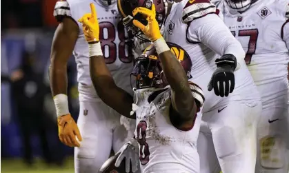  ?? Nam Y Huh/AP ?? Washington Commanders running back Brian Robinson Jr celebrates after his touchdown. Photograph: