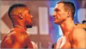  ??  ?? British boxer Anthony Joshua (L) and Ukrainian boxer Wladimir Klitschko (R) face each other during the weigh-in ahead of their bout at Wembley in London.