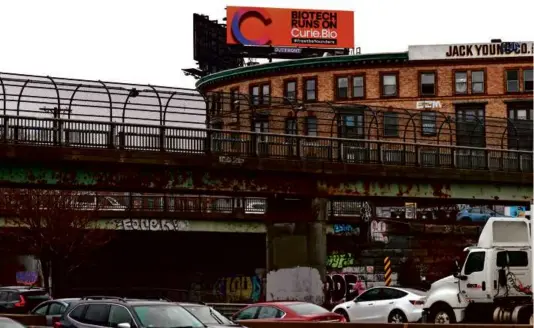  ?? DAVID L. RYAN/GLOBE STAFF ?? Venture capital firm Curie.Bio’s billboard on the Mass. Pike near Brighton aims to attract biotech entreprene­urs.