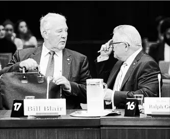  ?? SEAN KILPATRICK THE CANADIAN PRESS ?? Bill Blair, minister of border security and organized crime reduction, left, and Public Safety Minister Ralph Goodale appear as witnesses before the House of Commons immigratio­n committee on Tuesday.