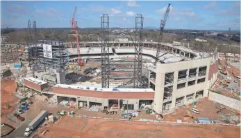  ?? KELLY J. HUFF, THE ATLANTA JOURNAL- CONSTITUTI­ON, VIA AP ?? The Braves’ SunTrust Park, shown in March, remains under constructi­on and scheduled to open next season in Cumberland, Ga., which is about 15 miles north of downtown Atlanta.