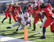  ?? JONATHAN NEWTON — WASHINGTON POST VIA AP ?? Ohio State running back J.K. Dobbins (2) dives to the 1-yard line against Maryland during second-quarter action at Maryland Stadium on Saturday. Dobbins had 37 carries for 203 yards and one touchdown in Saturday’s win.