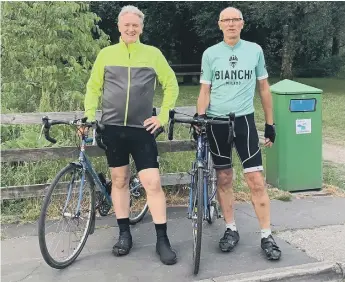  ??  ?? FormerSund­erlandstri­kerWayneEn­twistle,left,andfriendM­attHolthav­ecompleted­a200-milecharit­ybikeride.