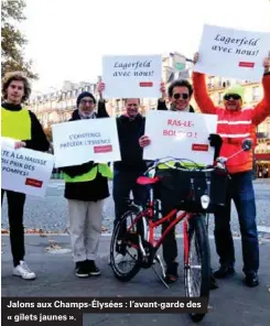  ??  ?? Jalons aux Champs-élysées : l'avant-garde des « gilets jaunes ».