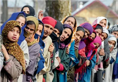  ?? AFP ?? Kashmiri villagers look on during the funeral of militant commander Noor Mohammad Tantray in Aripal village on Tuesday. —