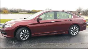  ?? ROBERT DUFFER/CHICAGO TRIBUNE ?? At 48 mpg, the Honda Accord Hybrid in Touring trim is a premium-leaning sedan with peerless fuel economy.