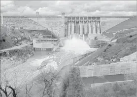  ?? Gary Coronado Los Angeles Times ?? FOLSOM LAKE continued to rise as the Folsom Dam released water into the American River on Monday. The lake had risen 13 feet since Sunday.