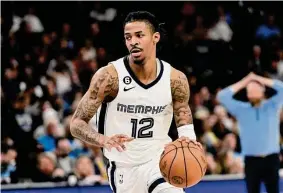  ?? Brandon Dill/Associated Press ?? Grizzlies guard Ja Morant is the NBA’s top scorer in pick-and-roll situations; the Rockets are the league’s worst team defending those plays.