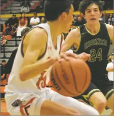  ?? ?? Matthew Mondragon dribbles away from defender Tyler Gilmore on Saturday (March 5).