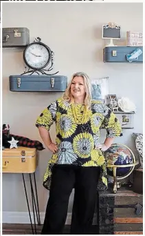 ??  ?? Travel expert Lorraine Simpson at her new Pelham shop. This is where she remotely films travel segments for television show Cityline. She welcomes the community to drop in — there is ample room for social distancing and browsing.
