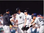  ?? Eduardo Munoz Alvarez / Associated Press ?? New York Yankees starting pitcher Gerrit Cole, center, is relieved in the sixth inning against the Cleveland Indians on Sunday in New York.