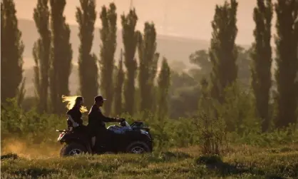  ?? Photograph: Sergei Malgavko/Tass ?? The National Farmers’ Federation has backed new regulation­s which mandate rollover bars on quad bikes in Australia.