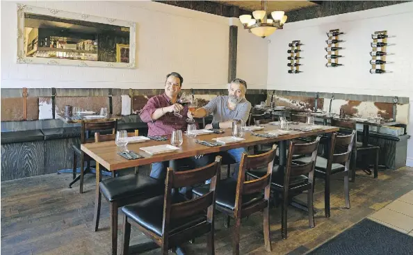  ??  ?? Chris Mena, left, and Lino Oliveira of Bodega Tapas Bar used their knowledge of the neighbourh­ood and a renovation to beat a cursed location.