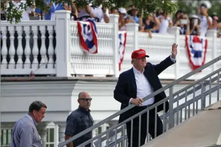  ?? JULIE JACOBSON, THE ASSOCIATED PRESS ?? Like Donald Trump here at the Trump National Golf Club, the president’s disapprova­l rating among Americans is climbing — to 58 per cent, according to the latest Washington Post-ABC News opinion poll.