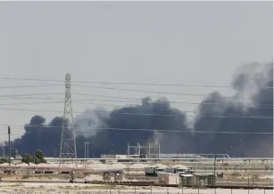  ?? (Reuters) ?? SMOKE IS SEEN following a fire yesterday at an Aramco facility in the eastern city of Abqaiq, Saudi Arabia.