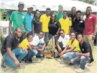 ??  ?? Students and staff who represente­d the College of Agricultur­e Science and Education at Agri-Fest 2017 held at Jamaica College on May 21. At centre, touching the cassava grown at the college, is its public relations and communicat­ion coordinato­r,...