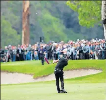  ?? THE ASSOCIATED PRESS] [RYAN KANG/ ?? Dustin Johnson hits his approach shot on the 13th hole during the second round of the Genesis Open on Saturday in the Pacific Palisades area of Los Angeles.