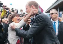  ?? RICHARD LAM ?? No one was happier to get a hug from Prince William than Tina Coligado, who arrived at Jack Poole Plaza at 6:45 a.m. and waited in the crowd for hours to catch a glimpse of the visiting royal couple.