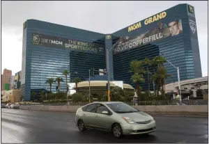  ?? (AP) ?? A car passes the MGM Grand hotel/casino on Sept. 20 in Las Vegas.