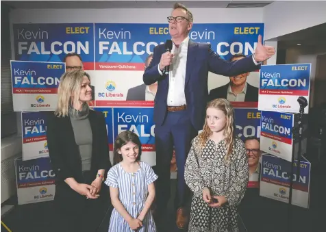  ?? THE CANADIAN PRESS/DARRYL DYCK ?? B.C. Liberal leader Kevin Falcon is joined by his wife Jessica Elliott and daughters Rose, centre, and Josephine as he addresses supporters after winning a byelection for a seat in the legislatur­e in the riding of Vancouver-Quilchena, in Vancouver on Saturday.