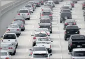  ?? DAVID MCNEW — GETTY IMAGES FILE ?? Morning traffic fills a Los Angeles freeway in 2013.