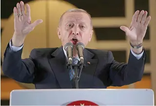  ?? AFP PHOTO ?? STRONG SHOWING
Turkey’s President Recep Tayyip Erdogan addresses his supporters following his runoff election victory at the presidenti­al palace in the capital Ankara on Monday, May 29, 2023.