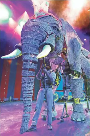  ??  ?? Queenie is operated by three puppeteers, two of whom are on stilts. The elephants are a part of Circus 1903, which begins its U.S. tour in Los Angeles. At left, Peanut stands on hind legs at the command of the ringmaster. PHOTOS BY ROBERT HANASHIRO,...